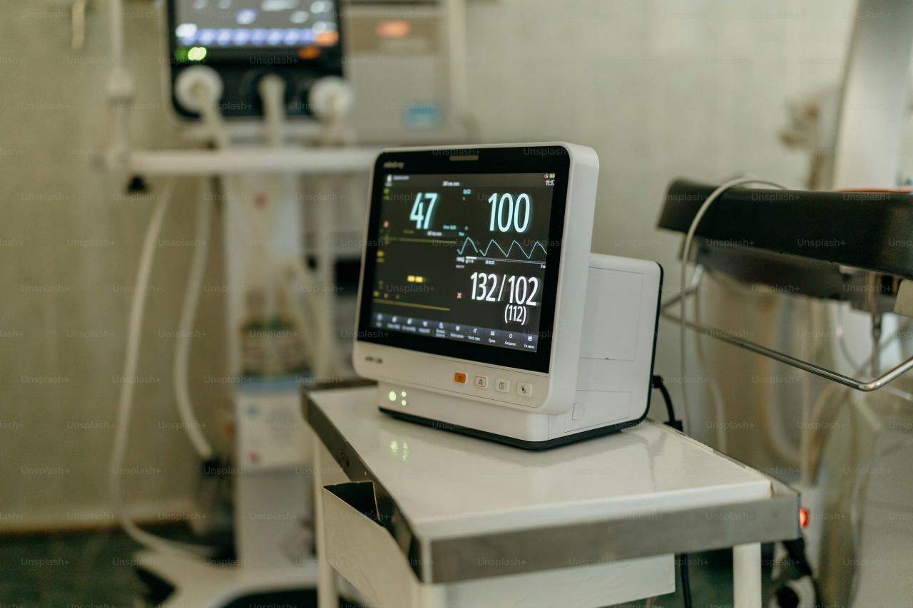 Medical monitor displaying vital signs in a hospital room