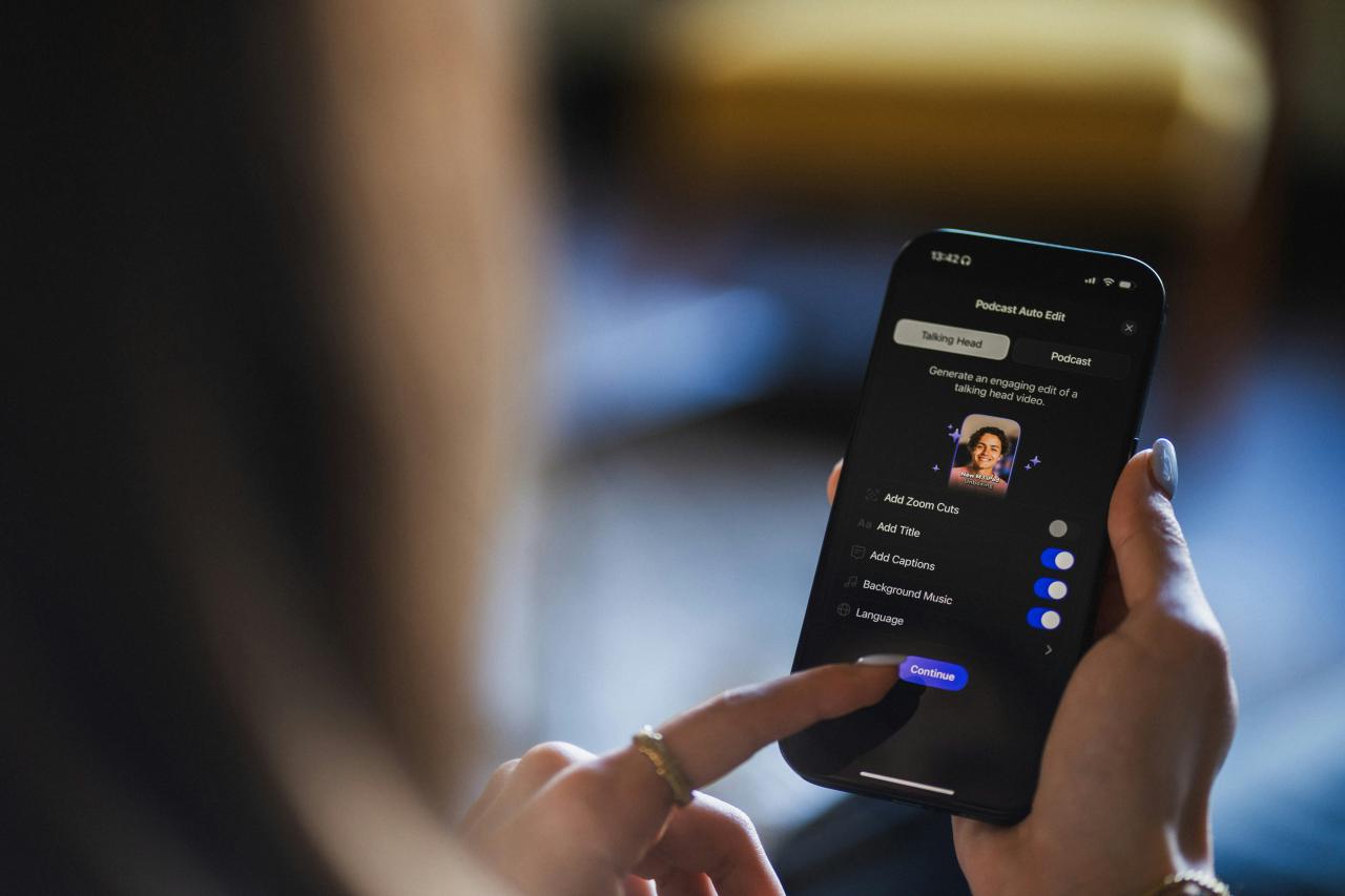 Person using a smartphone with a profile on screen.